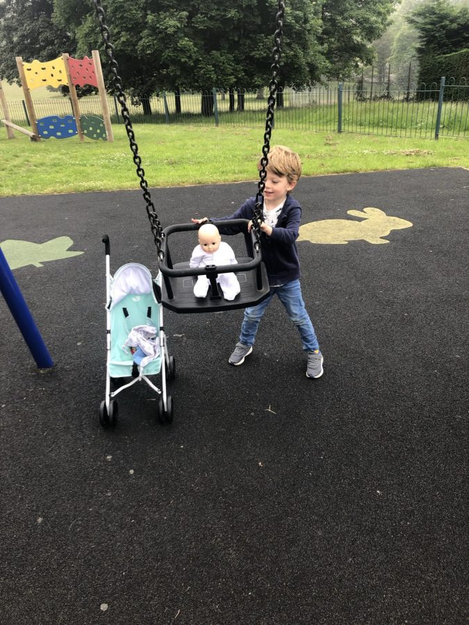 pushing baby in the swing