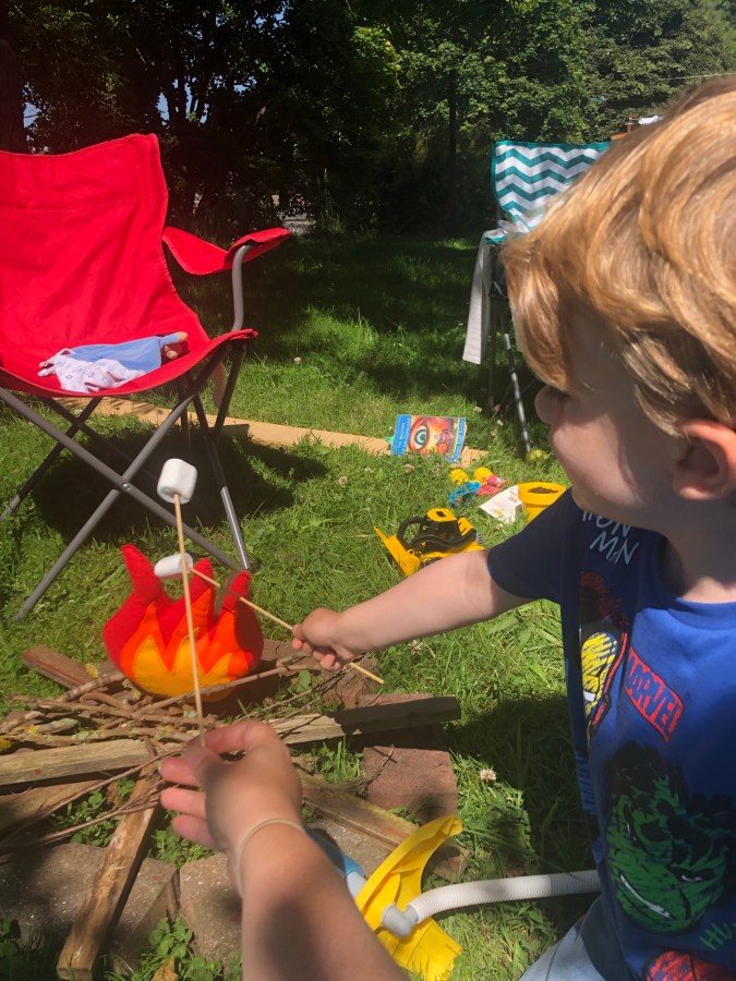 toasting marshmallows over an open fire